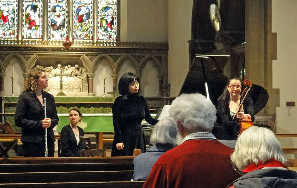 Musicians acknowledging the audience after a concert inside a church